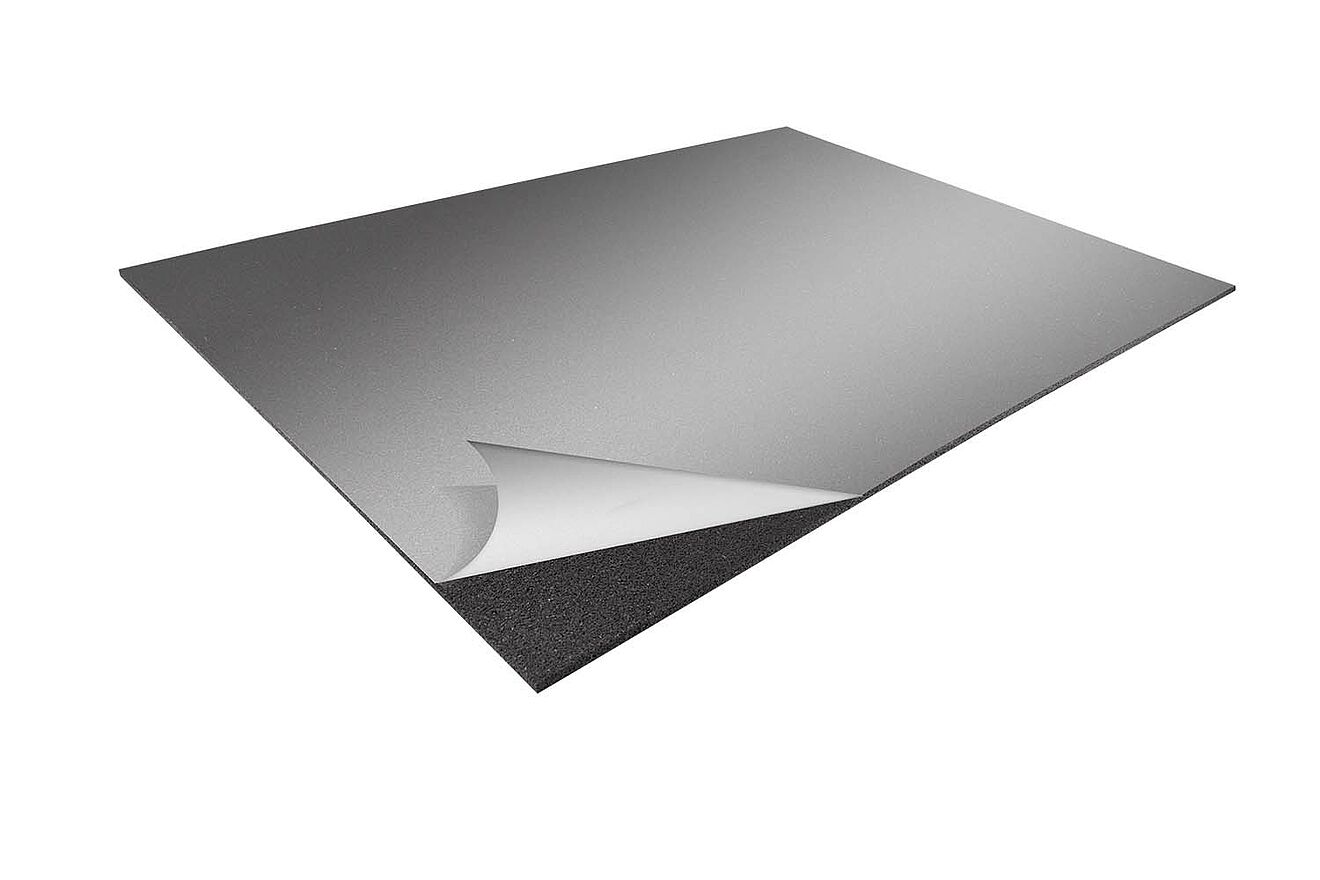 Self-adhesive protection mat “REGUPOL solar glue” with peel-off backing, corner lifted.